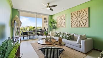 Deluxe Apartment | Living area | 42-inch Smart TV with satellite channels, Netflix, streaming services