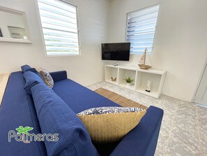 Comfort Villa, 3 Bedrooms, Private Pool, Lagoon View | Living room | 43-inch Smart TV with digital channels, Netflix, streaming services - Palmeras Beach Apartments (Guanica)