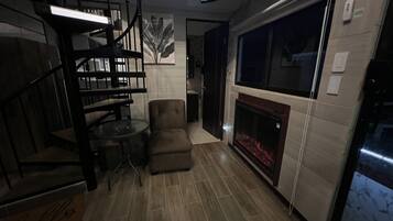 42-inch LED TV with digital channels, fireplace, video-game console