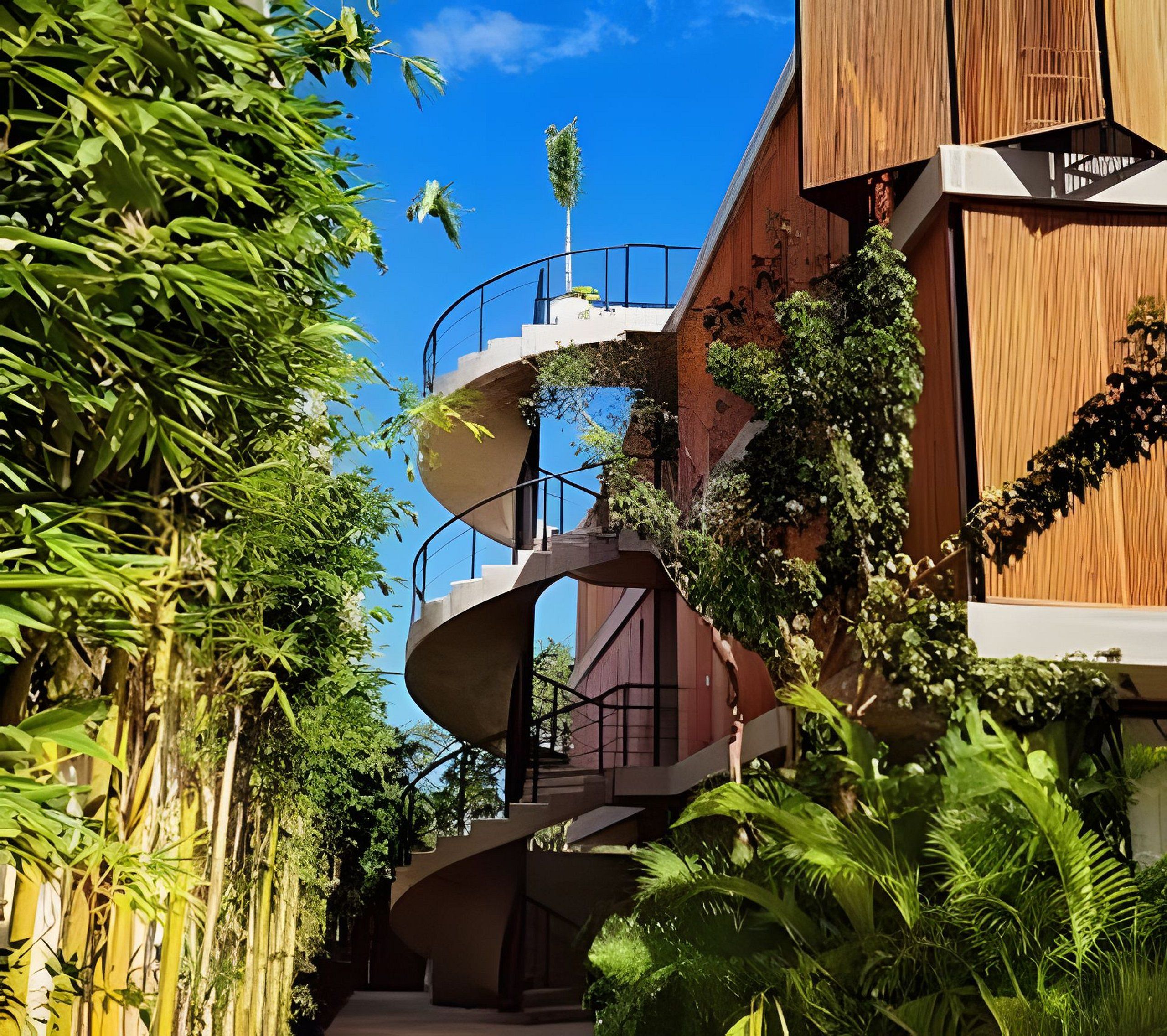 Een modern gebouw met meerdere balkons en een spiraaltrap.