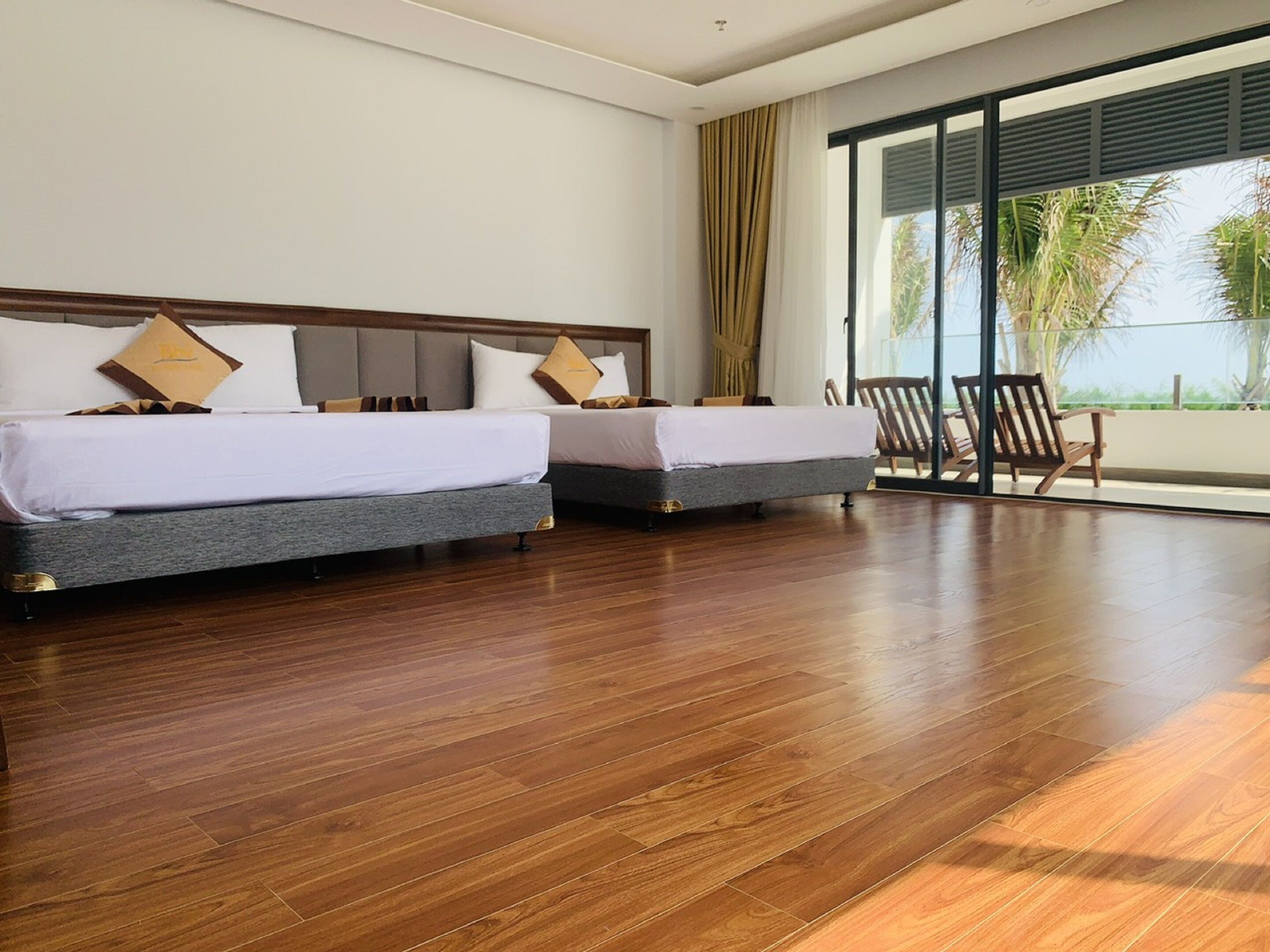 Deluxe Quadruple Room, 2 Queen Beds, Ocean View | Minibar, desk, free WiFi, bed sheets