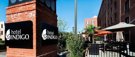 A hotel sign with the name 'hotel INDIGO.'