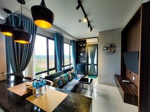 Family Apartment, 2 Bedrooms, Non Smoking, Ocean View | Living area | 31-inch flat-screen TV with digital channels - Palam Mansion at One Residence Apartment (Batam)