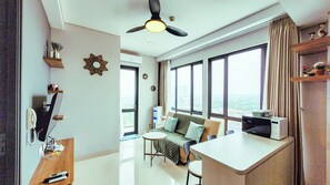Family Apartment, 2 Bedrooms, Non Smoking, City View | Living area | 31-inch flat-screen TV with digital channels - Palam Mansion at One Residence Apartment (Batam)