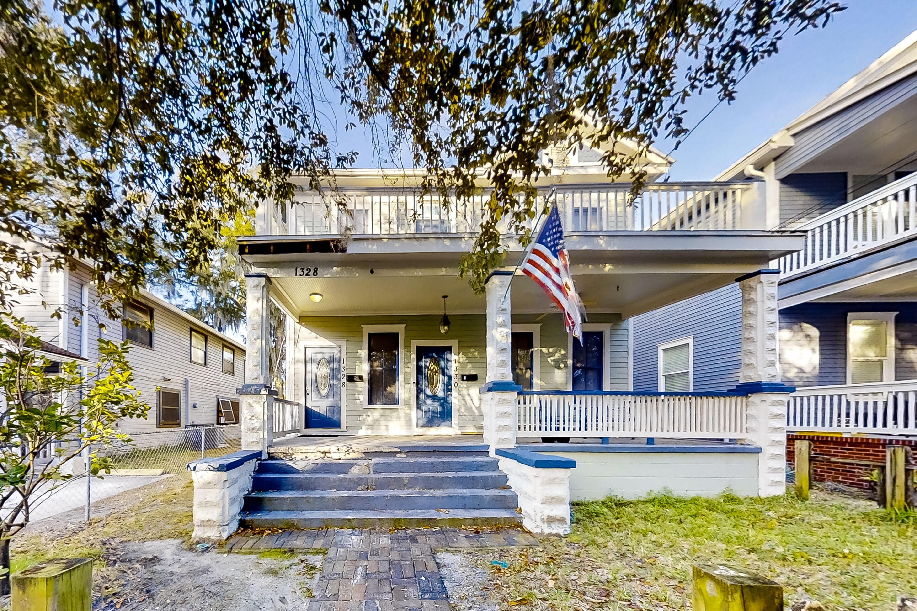 Centrally located hideaway with balcony, smart TVs, internet, W/D, & central AC