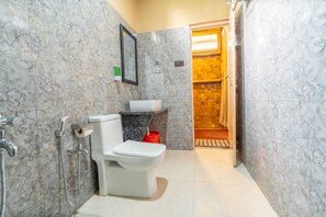 Serenity Deluxe Double Cottage AC | Bathroom | Free toiletries, hair dryer, slippers - Habitas Rhino By Nature Hunt (Bokakhat)