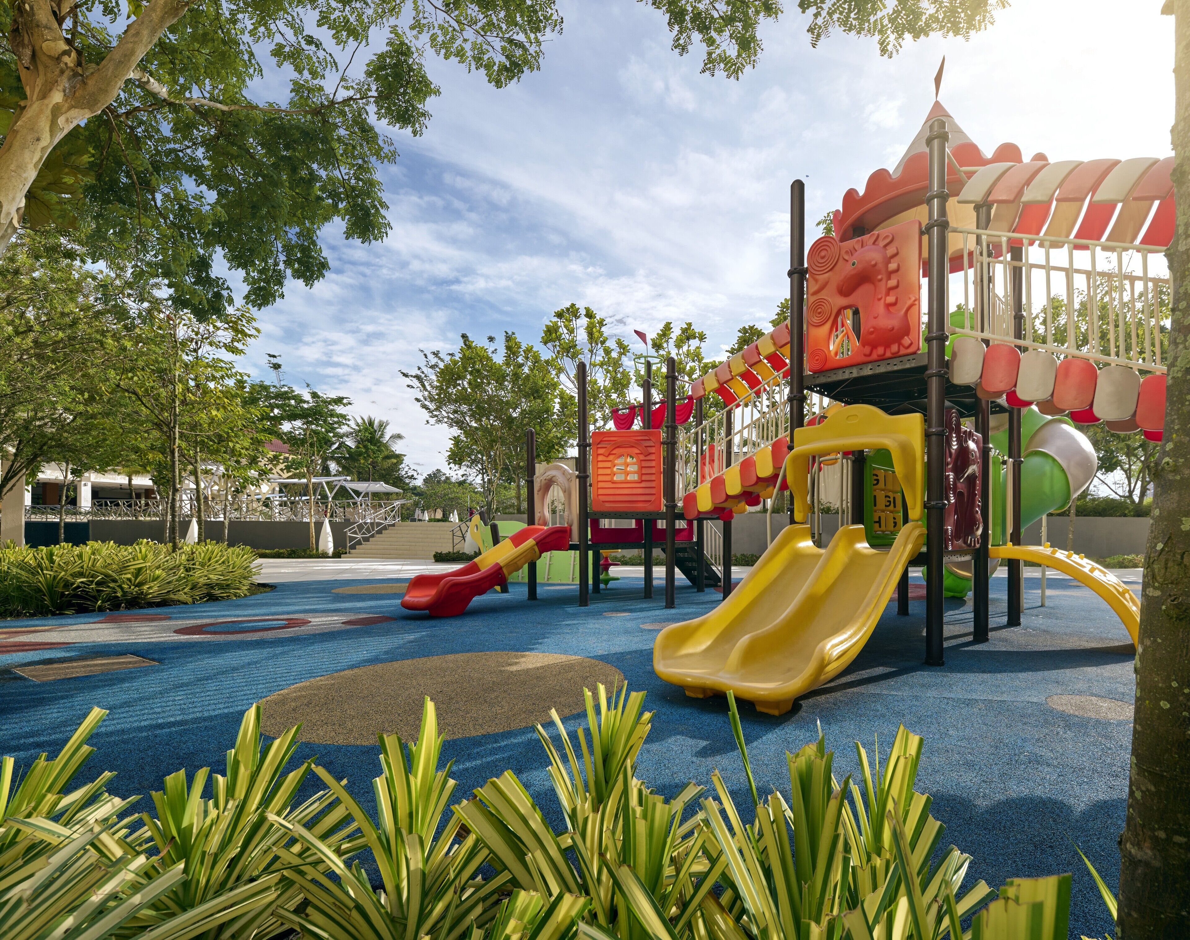 A playground with slides and climbing structures.