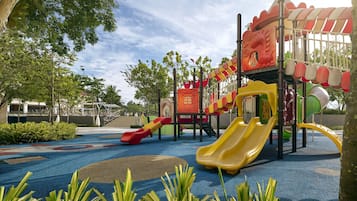 A playground with slides and climbing structures.