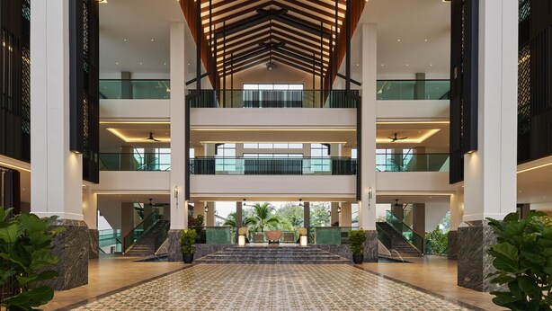 A spacious lobby with a high ceiling, multiple floors, and a patterned floor. - PARKROYAL A'Famosa Melaka Resort (Alor Gajah)