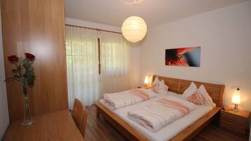 1 bedroom, desk, iron/ironing board, travel crib