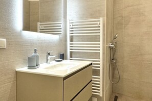 Shower, hair dryer, towels, soap