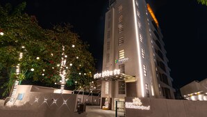 A hotel with a modern facade, a signboard with the name, and a well-lit entrance area. - Treebo Premium Heritage Grand, Thane (Thane)