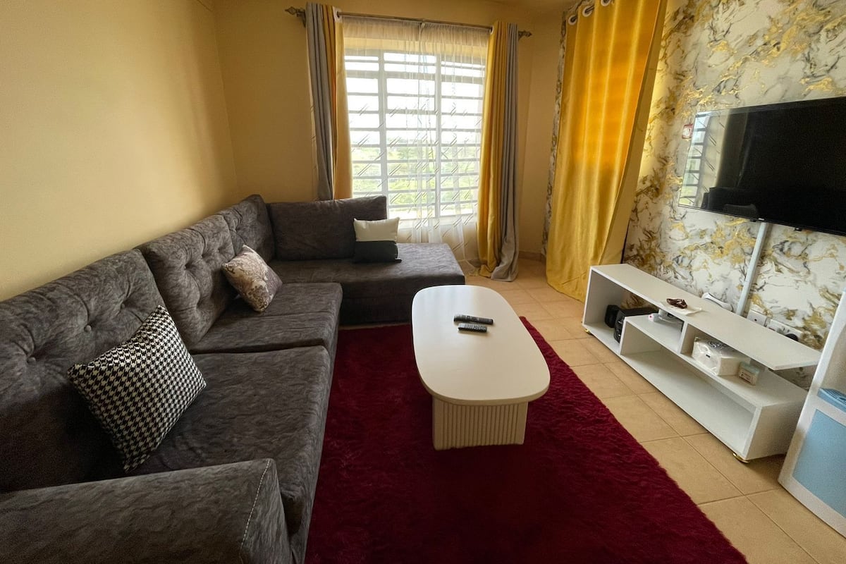 City Apartment | Living area | 24-inch Smart TV with digital channels