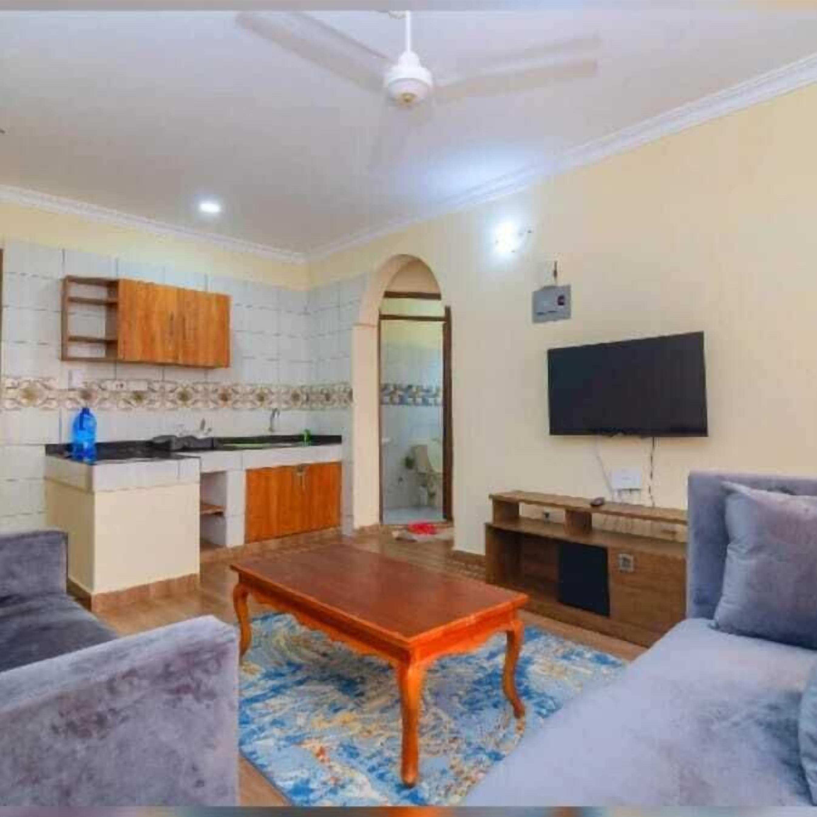 Apartamento Confort | Zona de estar | Smart TV de 24 pulgadas con canales digitales