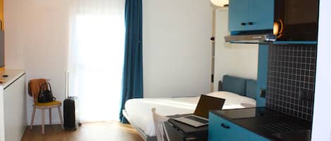 Premium bedding, blackout curtains, soundproofing, iron/ironing board