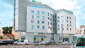 A modern hotel with a flat facade, multiple windows, and a sign reading "ibis styles". - Ibis Styles Bezons Paris La Défense (Opening March 2024) (Bezons)