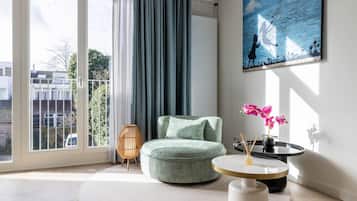 Deluxe Apartment, 1 King Bed | Living area | 50-inch flat-screen TV with digital channels