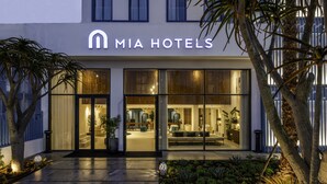 A modern hotel entrance with a glass facade, a visible lobby area, and a well-lit exterior. - MIA Mazagan Bay, El Jadida (El Jadida)