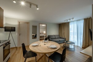 Apartamento luxo | Área de estar | TV LED 40 polegadas com canais a cabo
