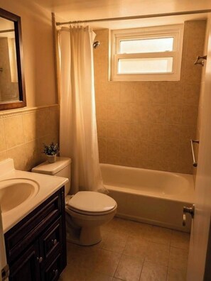 Shower, hair dryer, towels, shampoo