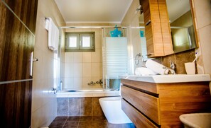 Shower, hair dryer, towels, soap