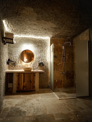 Grand Studio Suite, Multiple Beds | Bathroom | Hair dryer, slippers, towels, soap