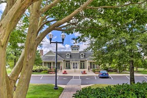 A building with a symmetrical facade, a central entrance with steps, and a parking lot in front. - 4 Mi to Beaches: Pet-friendly Lewes Condo! (Lewes)