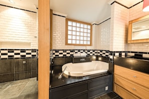 A modern bathroom with a black and white checkered backsplash, a large window, and a black countertop. - City Luxury 3BR Prime Location  (Brussels)