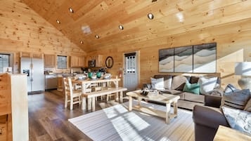 Signature Cabin, Multiple Bedrooms, Hot Tub, River View | Living room | 65-inch Smart TV with cable channels, fireplace