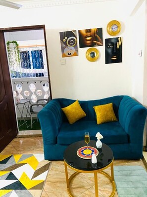 Business Studio | Living area | 24-inch Smart TV with digital channels - Lux Suites Bamburi Cozy Apartments (Mombasa)