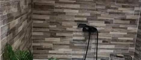 Shower, hair dryer, towels, toilet paper