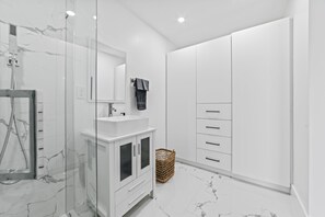 Shower, hair dryer, towels, soap