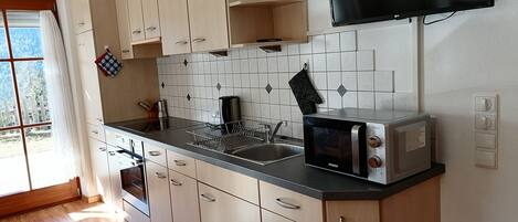 Fridge, microwave, stovetop, coffee/tea maker