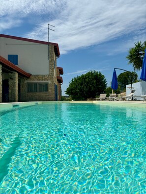 Seasonal outdoor pool, pool umbrellas, pool loungers