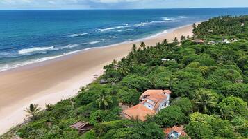 On the beach, sun-loungers, beach umbrellas, beach towels