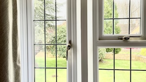 A room with two windows, one with a door and one without. - Southlands B&B (Cheltenham)