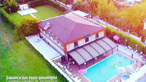 A large building with a swimming pool and outdoor seating area. - X SAPANCA OTEL (Sapanca)