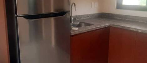 Fridge, microwave, stovetop, coffee/tea maker