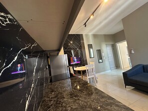 Premium Apartment | Living area | 42-inch TV with cable channels, Netflix, streaming services