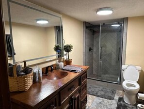 Shower, hair dryer, towels, soap