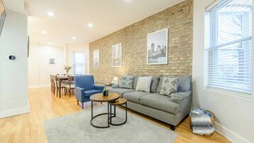 Smart TV, fireplace, books, computer monitors