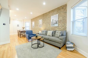 Smart TV, fireplace, books, computer monitors