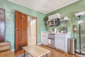 Fridge, microwave, cookware/dishes/utensils, cleaning supplies