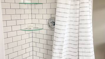Shower, hair dryer, towels, shampoo