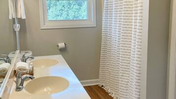 Shower, hair dryer, towels, shampoo