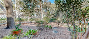 Spacious centrally located condo with patio, open layout, smart TVs, AC, & W/D