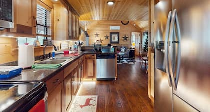 Water-view rustic cabin with large front porch, W/D, streaming, kitchen, & AC