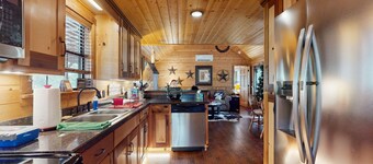 Water-view rustic cabin with large front porch, W/D, streaming, kitchen, & AC