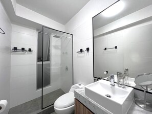 Shower, hair dryer, towels, soap