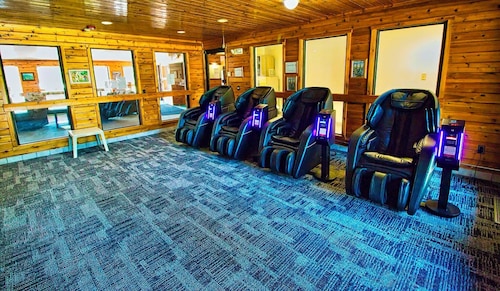A dog friendly room with two queen beds, private bathroom, mini fridge, and single-serve coffee maker.